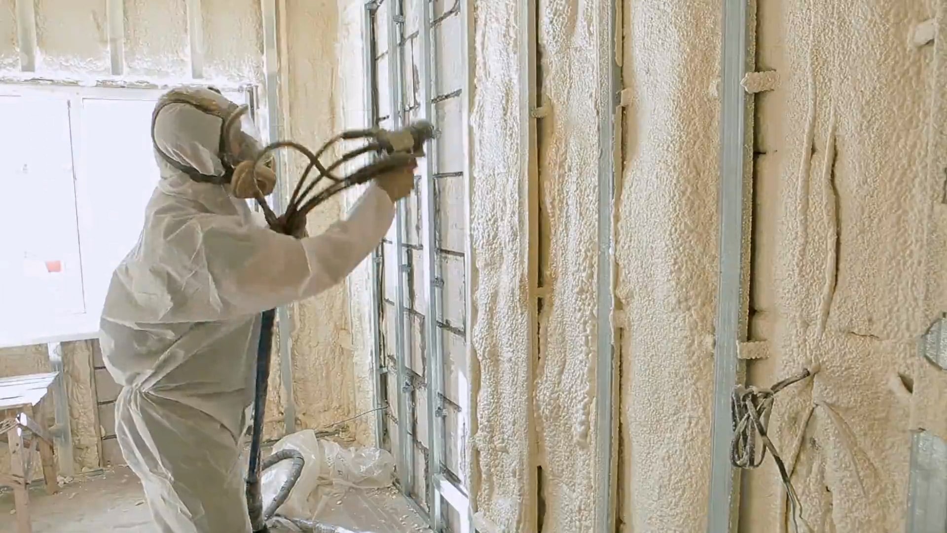 man installing insulation